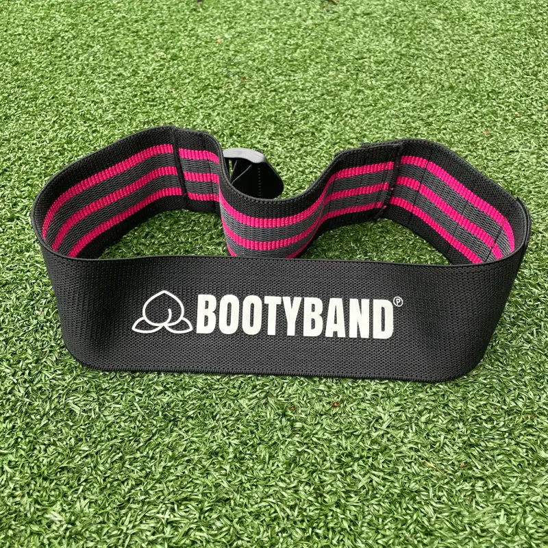 Zwarte en roze verstelbare booty band voor workout en krachttraining